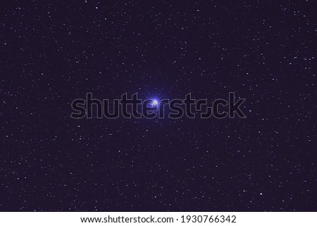 The night sky with Sirius star in the constellation.