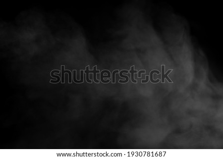 Close-up view of group of white smoke or steam spray from a humidifier. Isolated on black background