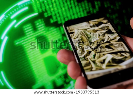 Man holding mobile phone, bitcoin icon , block chain with graph of stock market background , cryptocurrencies or bitcoin concept