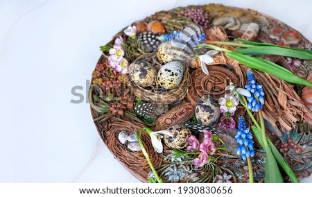 Wiccan Altar for spring Ostara sabbat. wheel of the year with flowers, feathers and eggs on table. Esoteric Ritual for Ostara holiday. Magical Spring equinox Royalty-Free Stock Photo #1930830656