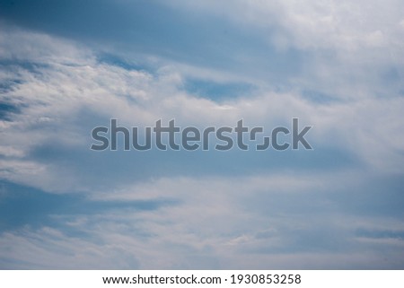Scattered cloud clusters in a blue sky, blue sky background with white clouds, 
 Royalty-Free Stock Photo #1930853258