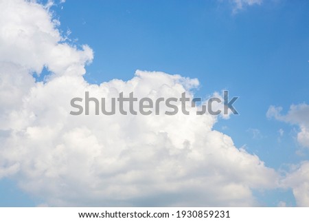 Beautifully spread clouds in the blue and clear sky. High resolution photo editing source for synthetic source