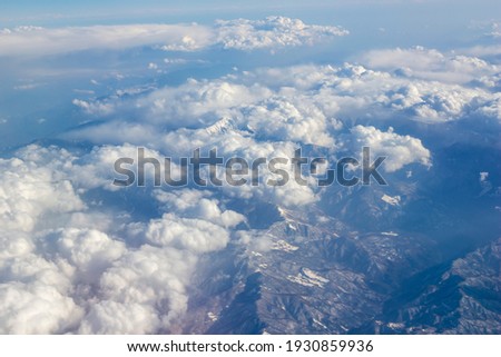 Blue and clear sky from the plane, beautifully spread clouds. High resolution photo editing source for synthetic source