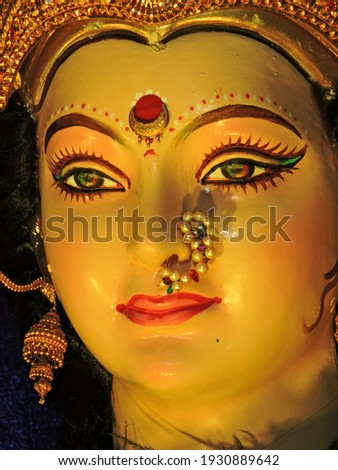 Closeup face photo of indian hindu goddess maa durga shakti idol in sacred temple on the occasion of navratri Royalty-Free Stock Photo #1930889642