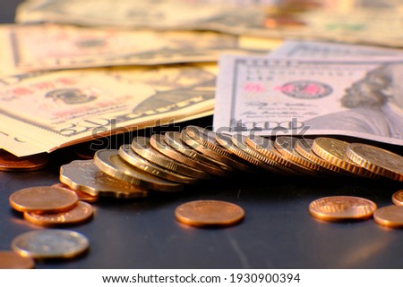 Coin and banknote on table background and business or finance saving money