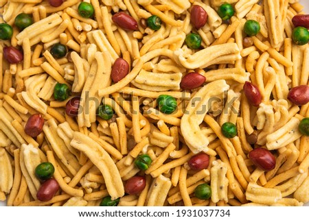 Bombay mix or Chanachur or Chiwda or farsan is an Indian snack mix, popular tea-time food from India Royalty-Free Stock Photo #1931037734
