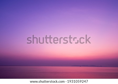 Twilight sunrise sky over tropical sea and beach in Thailand. Purple filtered Royalty-Free Stock Photo #1931059247