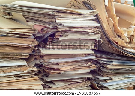 Old, randomly folded paper, as waste paper. Royalty-Free Stock Photo #1931087657