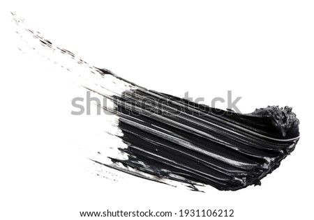Smudged black mascara isolated on white background. Cosmetic product swatch. Paint brush stroke Royalty-Free Stock Photo #1931106212