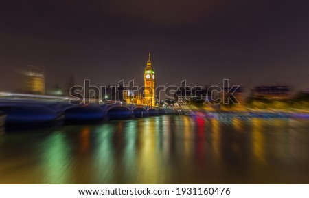 Big Ben in London at night on the Thames
