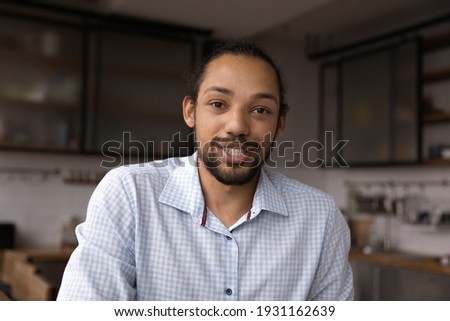 Head shot portrait close up African American man speaking at camera, mentor teacher leading online lesson, blogger shooting vlog, businessman making video call, chatting, involved in internet meeting