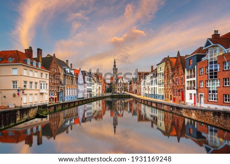 Bruges, Belgium historic canals at dusk. Royalty-Free Stock Photo #1931169248