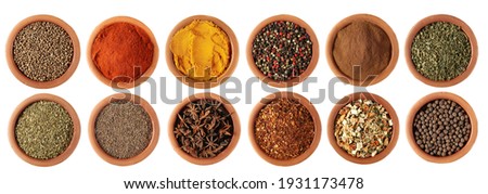 Set spice, coriander, red paprika powder, turmeric, colorful mixed pepper grains, cinnamon, dry chives, oregano, cumin, star anise, spicy chili pepper flake, vegetable mix, allspice, isolated on white Royalty-Free Stock Photo #1931173478