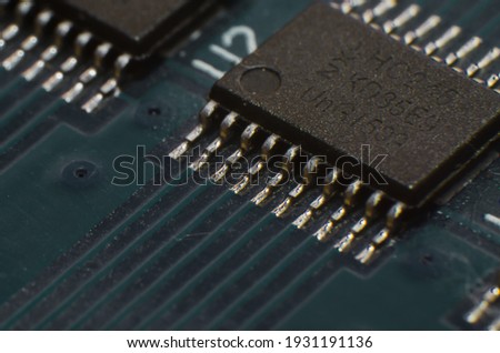 Close-up printed circuit board with electronics components. Macro photography for electric background, processor and SMD IC mounted components.