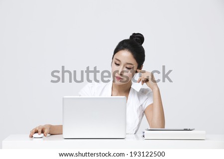 Korean woman working on laptop