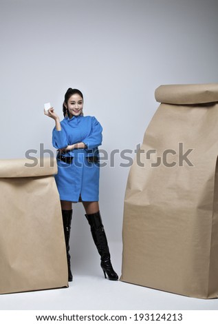 Korean woman with paper shopping bags