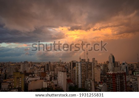 dramatic clouds over Buenos Aires city at sunset with Rio de la Plata river in the back, Argentina