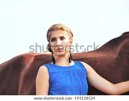 young beautiful serious  girl  with  horse