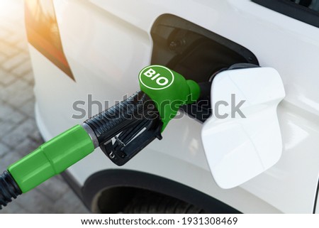 Refueling the car with biofuel Royalty-Free Stock Photo #1931308469