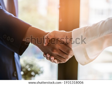 contractor and Client shaking hands with team builder in renovation site. Royalty-Free Stock Photo #1931318006