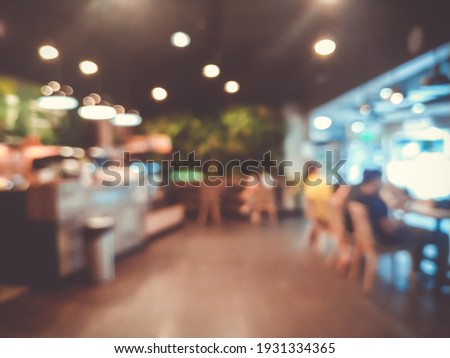 Blurred images of the coffee shop cafe interior background and lighting bokeh Royalty-Free Stock Photo #1931334365