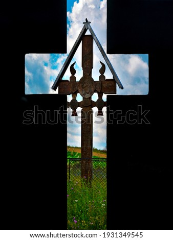 a cross seen through another cross