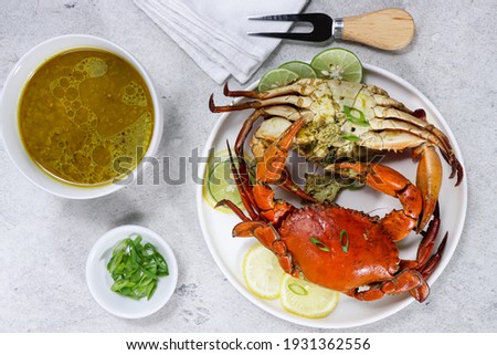 Kepiting kuah kari or traditional Javanese crab curry soup with coconut milk. Royalty-Free Stock Photo #1931362556