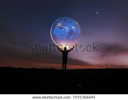 Earth in human hands. earth day. energy saving , elements of this image furnished by NASA