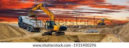 excavator at work on construction site Royalty-Free Stock Photo #1931400296