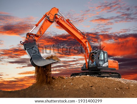 excavator at work on construction site Royalty-Free Stock Photo #1931400299