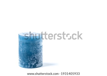 Hand made blue candlestick isolated on white background.