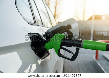 Refueling the car with biofuel Royalty-Free Stock Photo #1931409527
