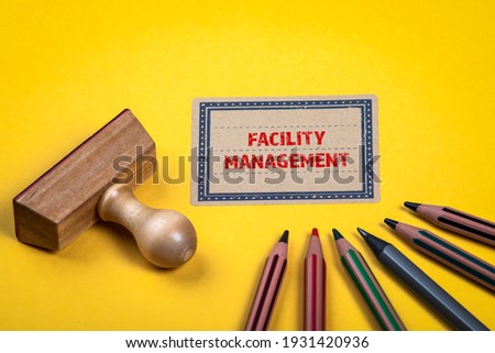 FACILITY MANAGEMENT. Yellow notes and documents folder. Office supplies.