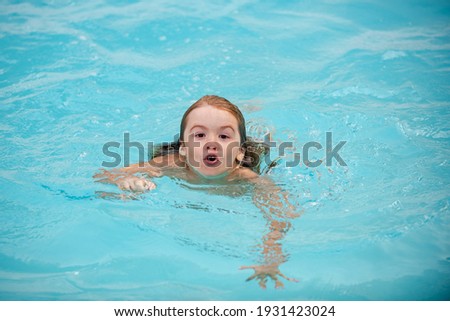 Child swimming in pool. Kids summer vacation. Summertime. Attractions concept Swimmingpool