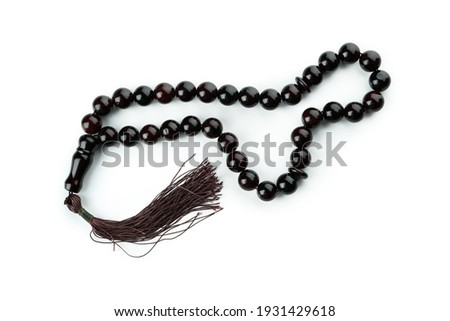 Rosary or prayer beads, isolated on white background Royalty-Free Stock Photo #1931429618