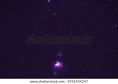 The night sky with Orion Nebula .