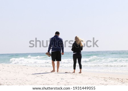 two people enjoying their vacation in the beach 