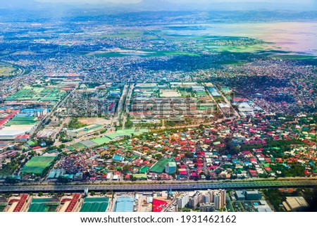 Manila suburb with small houses aerial panoramic view from the plane, Philippines