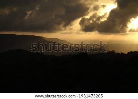 beautiful dramatic clouds at dawn with yellow sunset