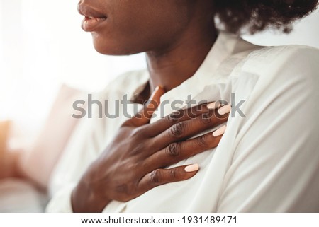Heart Health Care. Closeup Of Young Woman Feeling Strong Pain In Chest. Close-up Of Female Body With Hand On Chest. Girl Suffering From Painful Feeling, Having Health Issues. High Resolution Image Royalty-Free Stock Photo #1931489471