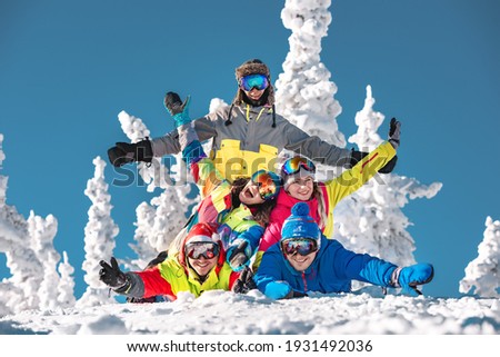 Group of five good friends are having fun at ski resort. Sheregesh, Siberia, Russia