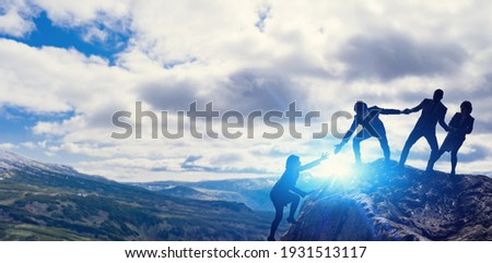 Teamwork concept. People who help their peers. Human relationship. Royalty-Free Stock Photo #1931513117