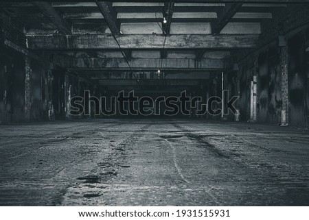 scary night underground parking. old abandoned building.  Royalty-Free Stock Photo #1931515931