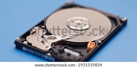 Open HDD on a blue background Royalty-Free Stock Photo #1931519834