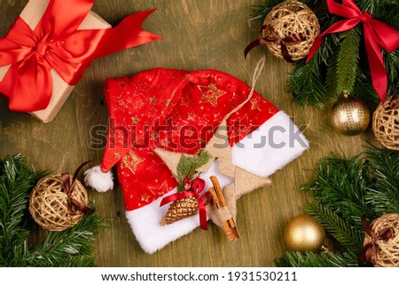 New year and christmas decorations on green wooden textured background, top view, free space for design