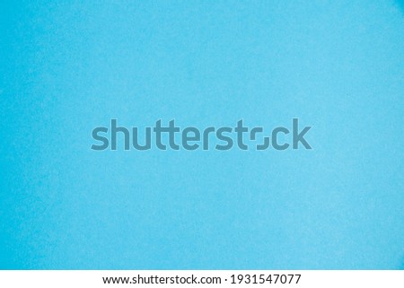 Background with copy space. Colored blue paper or cardboard with space for text, horizontal format.
