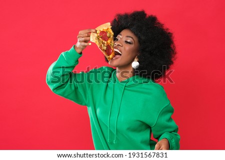 Pizza lover - young black woman. Royalty-Free Stock Photo #1931567831