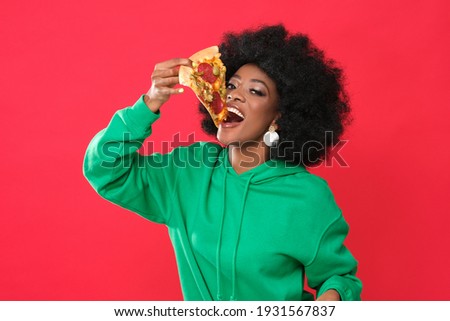 Pizza lover - young black woman. Royalty-Free Stock Photo #1931567837