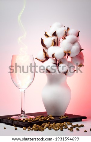 cotton in a vase and a glass with fire