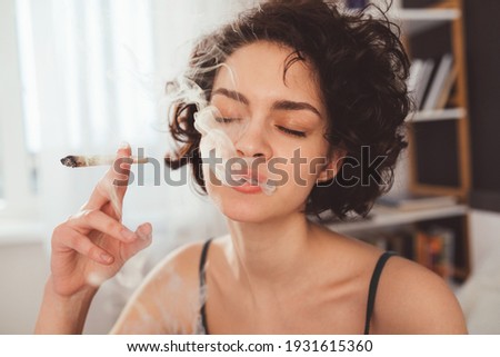 Close-Up Of Woman Smoking Weed  Royalty-Free Stock Photo #1931615360